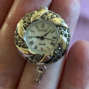 Vintage pendant watch silvertone stainless steel w/small marcasite stones.